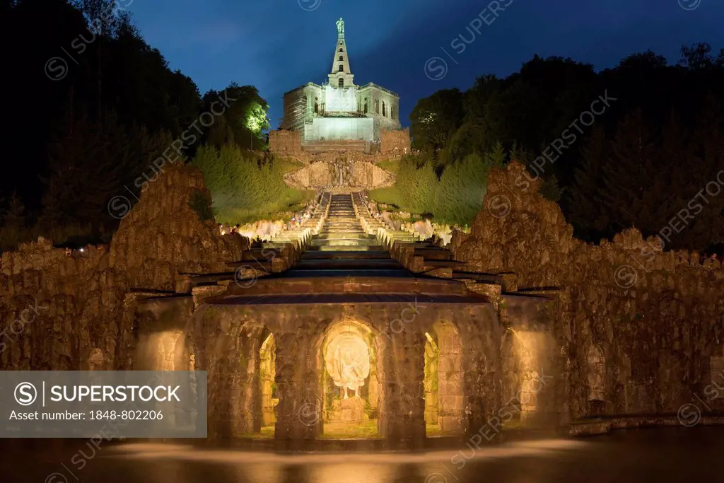 Illuminated cascades of the water feature of the Hercules monument at night, UNESCO World Cultural Heritage Site, Bergpark Wilhelmshöhe, Kassel, Hesse...