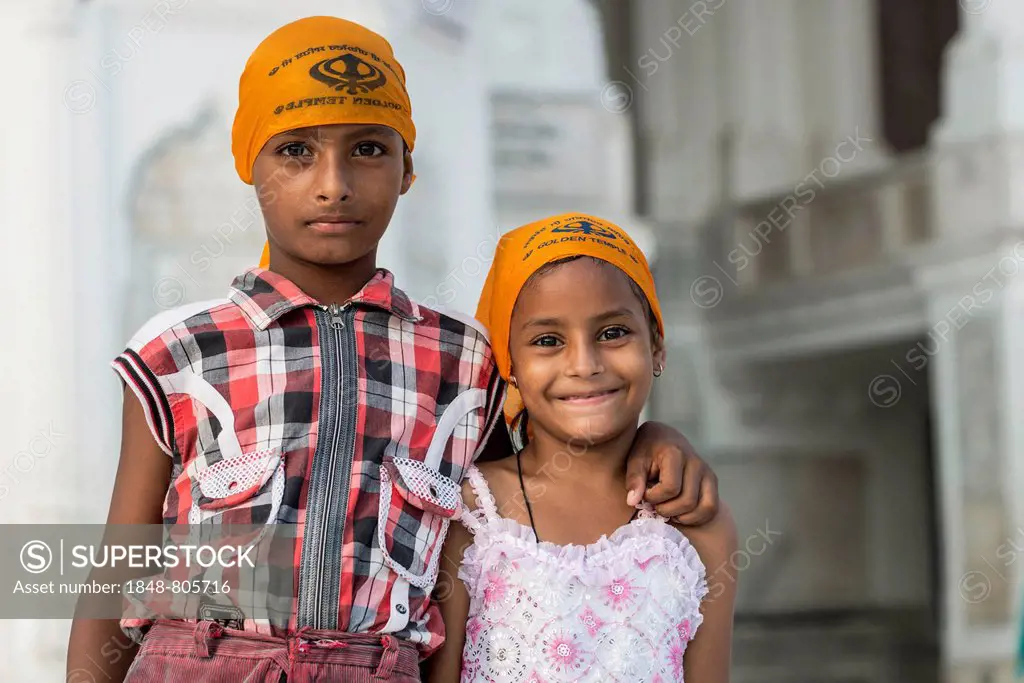 Two Sikh children at the Harmandir Sahib or Golden Temple, a holy Sikh temple, Amritsar, Punjab, India