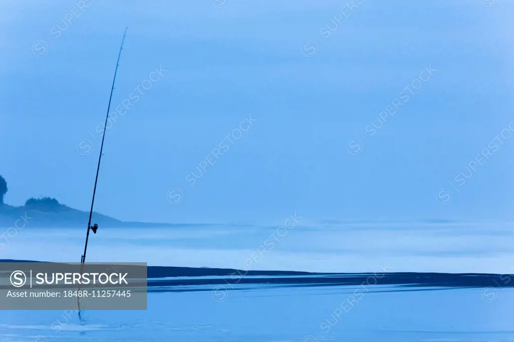 Fishing rod on the beach at dusk, Oakura, Taranaki Region, New Zealand