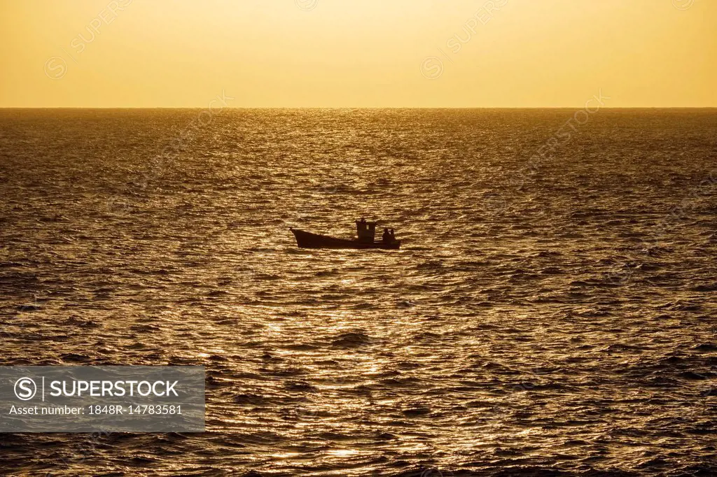 Fishing boat on sea in the evening light, Atlantic Ocean, La Gomera, Canary  Islands, Canary Islands, Spain - SuperStock