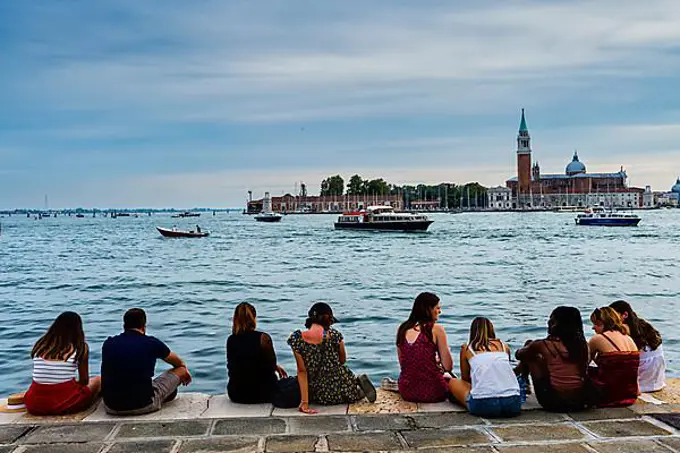Tourists on quay wall, Venice, Italy, Europe