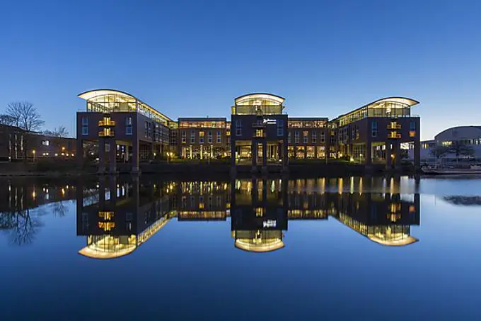 Radisson Blu Senator Hotel along the river Trave at sunset, Hanseatic City of Luebeck, Luebeck, Schleswig-Holstein, Germany, Europe