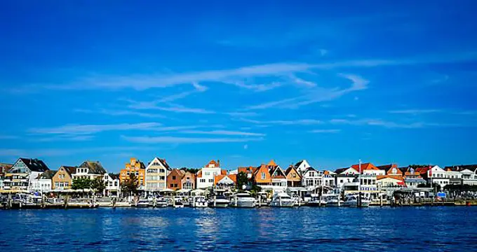 Front row commercial buildings and gastronomy in Travemuende on the river Trave. Hanseatic City of Luebeck. Schleswig-Holstein. Germany