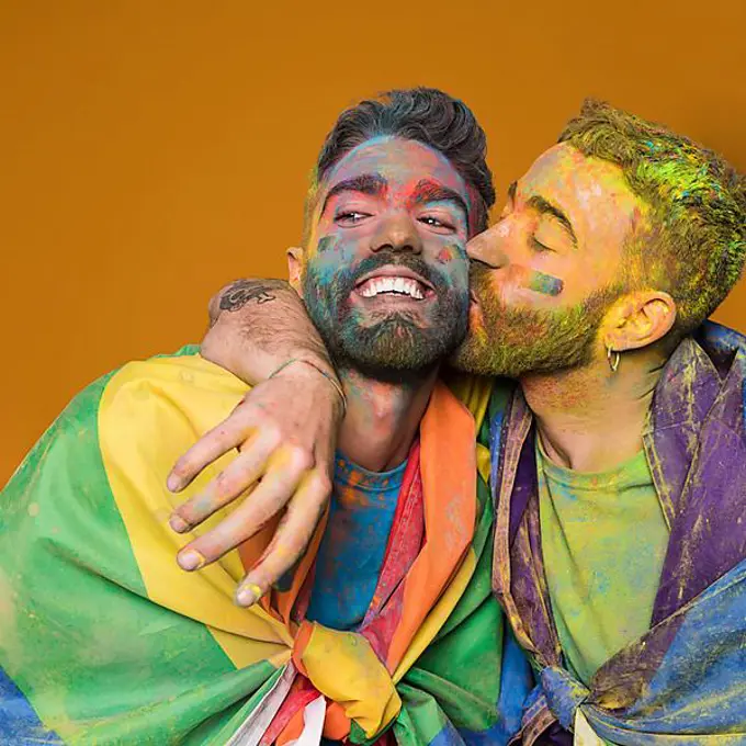 Playful gay couple rainbow colors