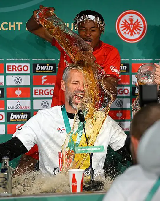 Beer shower during press conference PK for coach Coach Marco Rose by Mohamed Simakan (02) RasenBallsport Leipzig RBL, 80th DFB Cup Final, DFB Cup, Final, Olympiastadion Berlin, Germany, Europe