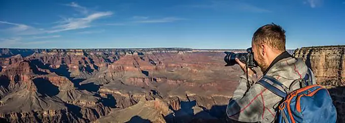 Tourist photographed in Grand Canyon, canyon landscape, eroded rock landscape, South Rim, Grand Canyon, Grand Canyon National Park, Arizona, USA, North America