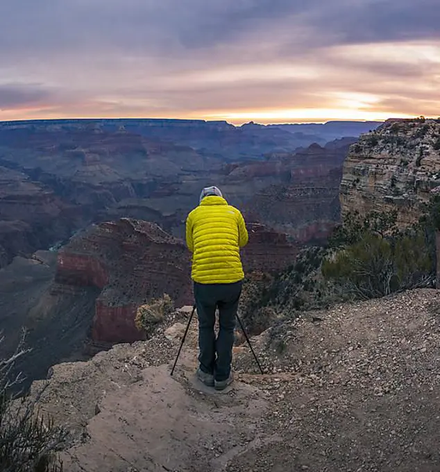 Tourist photographed in Grand Canyon, canyon landscape, eroded rock landscape, sunset, South Rim, Grand Canyon, Grand Canyon National Park, Arizona, USA, North America