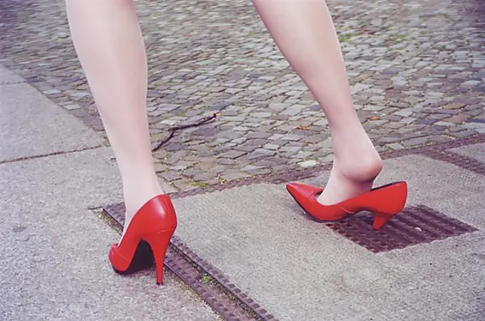 Misfortune, woman gets stuck in a hole with high heels, Berlin, Germany, Europe