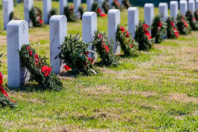 Veterans cemetery adorned with wreaths for the holiday season