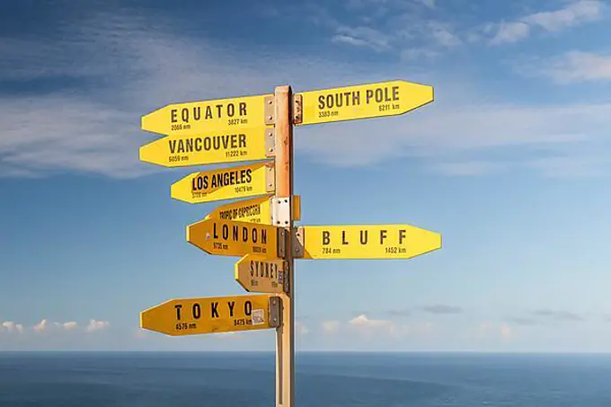 Yellow signs, signposts with various travel destinations, Cape Reinga, North Island, New Zealand, Oceania