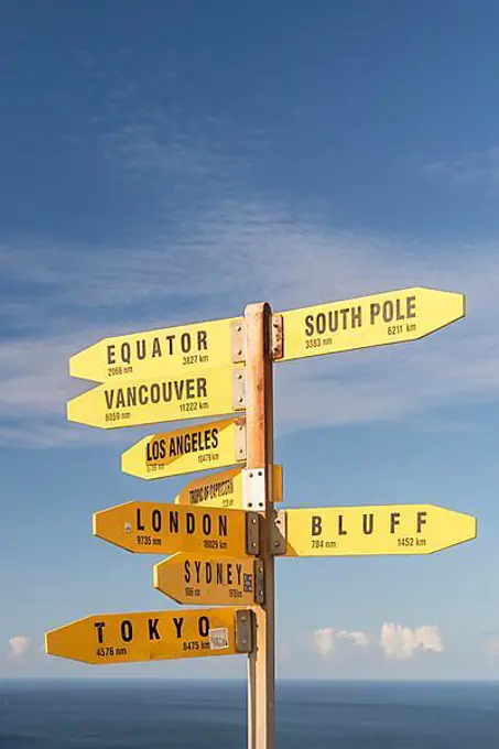 Yellow signs, signposts with various travel destinations, Cape Reinga, North Island, New Zealand, Oceania