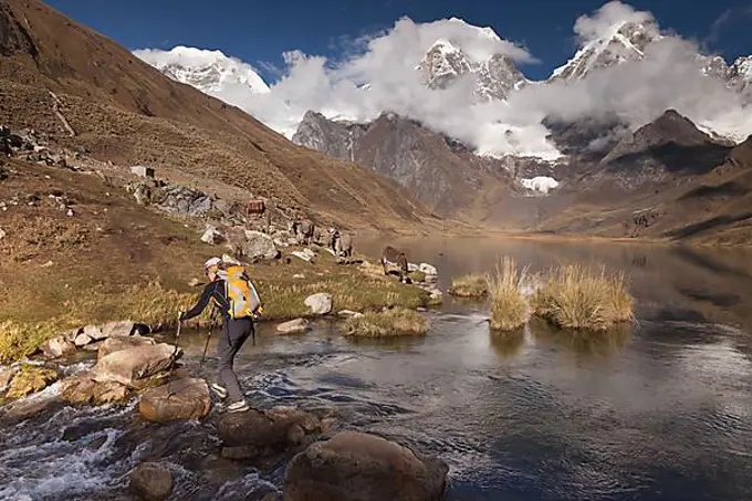 Mountaineer at Laguna Carhuacocha, Cordillera Huayhuash, Peru, South America