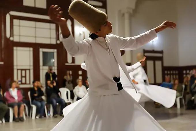 Whirling Dervishes dancing the Sema, a Dervish dance, Sirkeci Railway Station, Istanbul, Turkey, Europe, Istanbul, Istanbul Province, Turkey, Asia