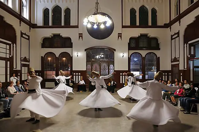 Whirling Dervishes dancing the Sema, a Dervish dance, Sirkeci Railway Station, Istanbul, Turkey, Europe, Istanbul, Istanbul Province, Turkey, Asia