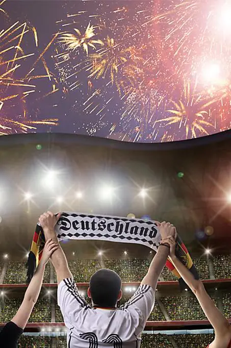 Football fan holding a scarf, lettering "Deutschland", German for "Germany", fireworks, stadium, crowd