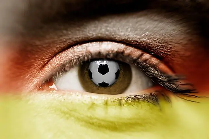 Woman's eye with the reflection of a soccer ball, women's soccer