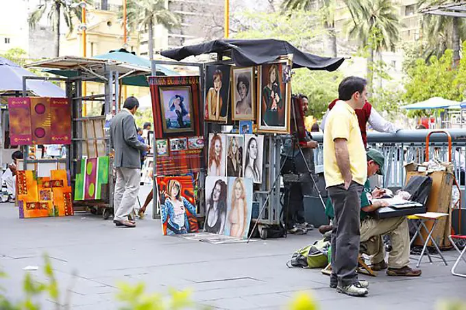 Street sale of paintings, Plaza de Armas, Santiago de Chile, Chile, South America