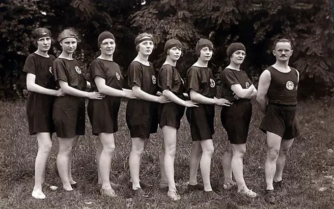 Historic photograph, female athletes with male trainer