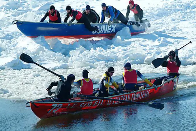 CAN, Canada , Quebec : Winter carnival in Quebec City, Canoe race over the partly frozen Saint Lawrence River, North America