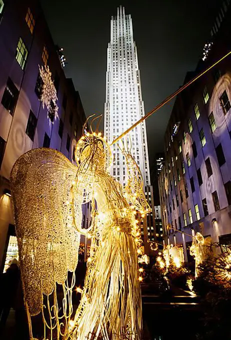 Huge illuminated Christmas angel in front of the General Electric Building, Rockefeller Center, New York City, USA, North America