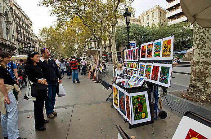 Artist's stand and tourists, Las Ramblas, Barcelona, Catalonia, Spain, Europe