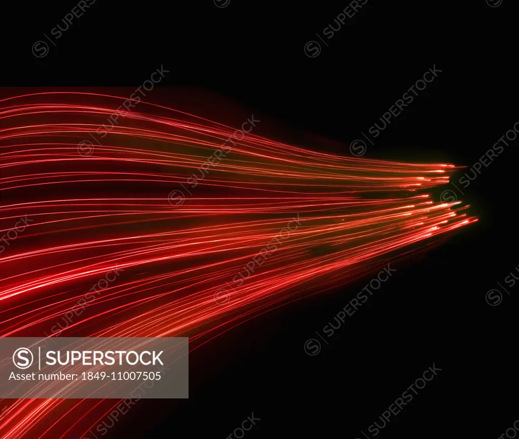 Abstract background pattern of glowing red fiber optic lights