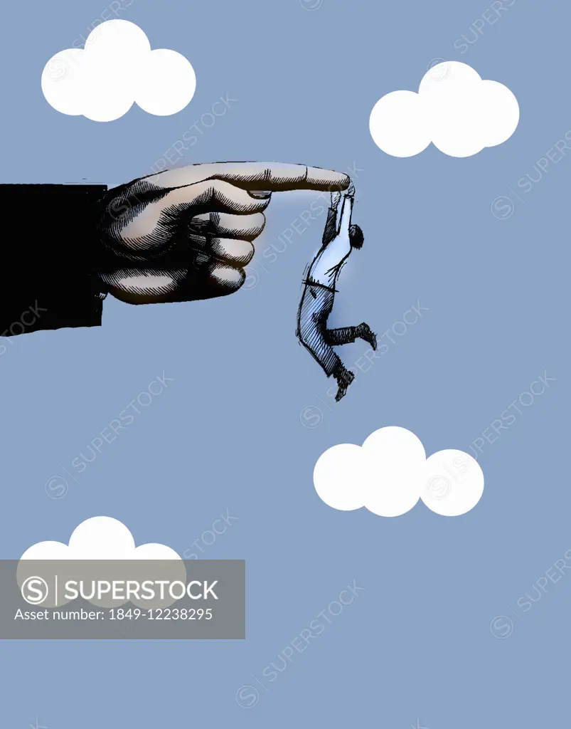 Businessman holding on to the edge of large finger