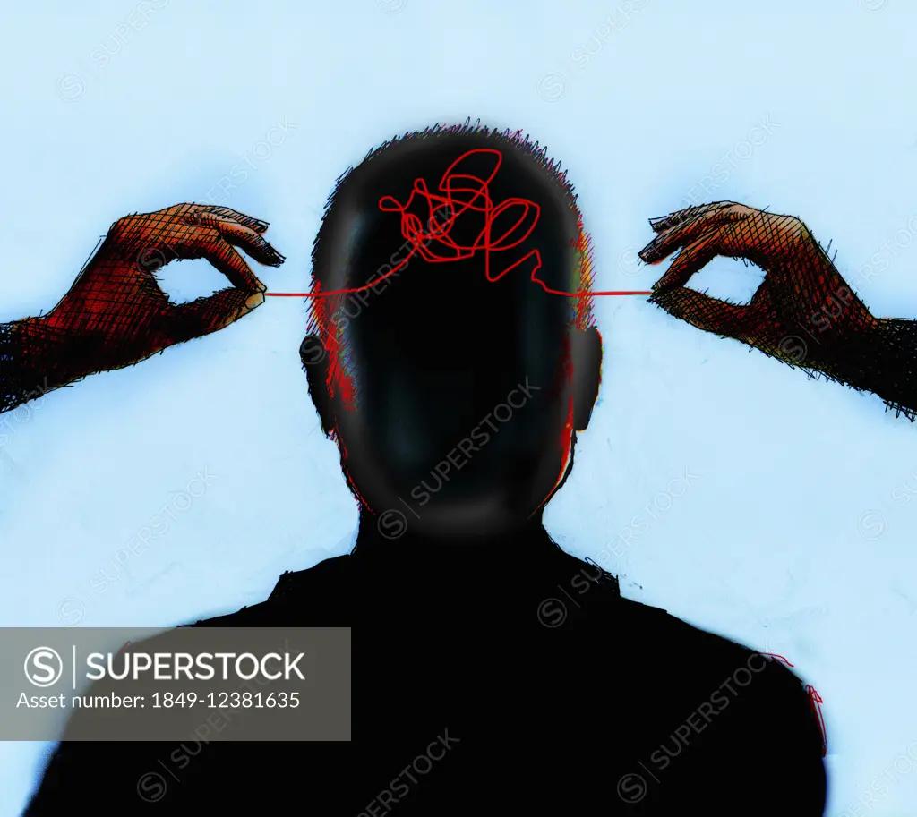 Hands untangling thread from inside of man's head