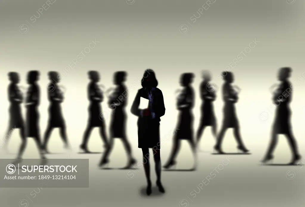 Silhouette of calm confident businesswoman standing out from the crowd