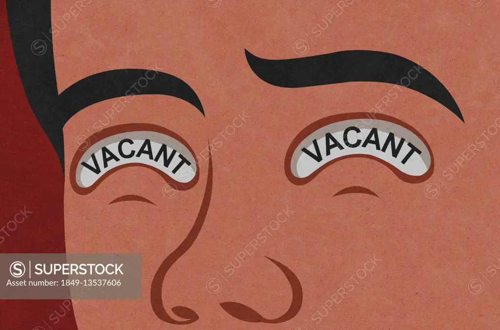 Close up of man's face with the word 'vacant' written in his eyes