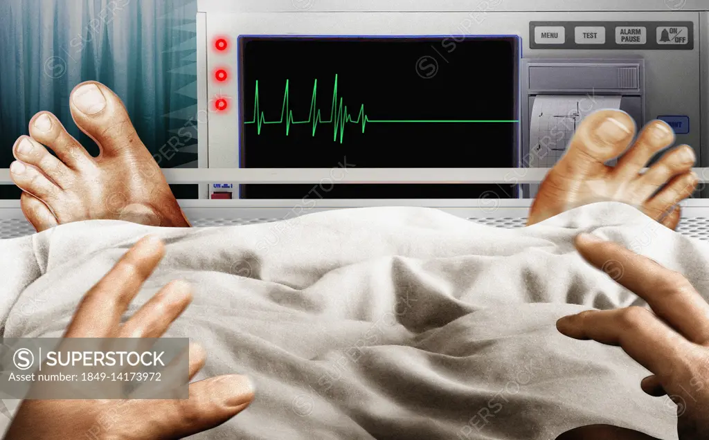 Frightened man in hospital bed seeing flatline pulse trace on monitor