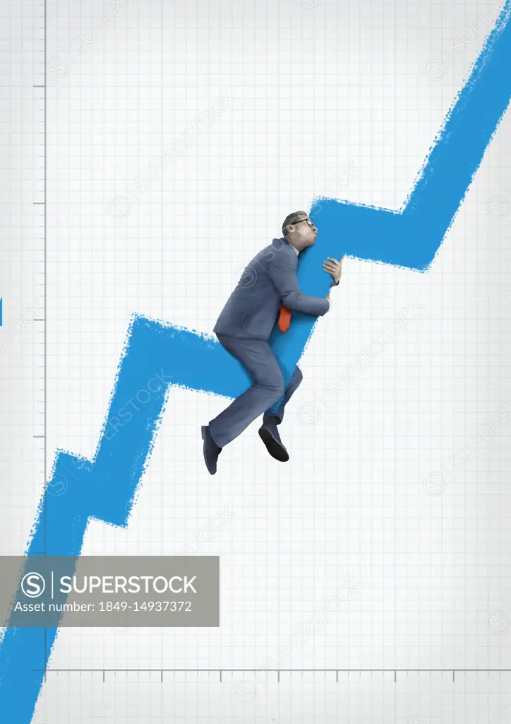 Businessman embracing rising line graph