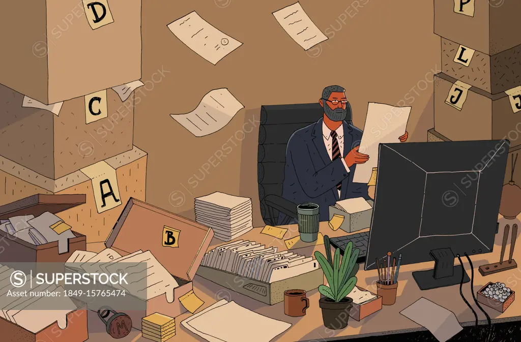 Overworked businessman with piles of paper