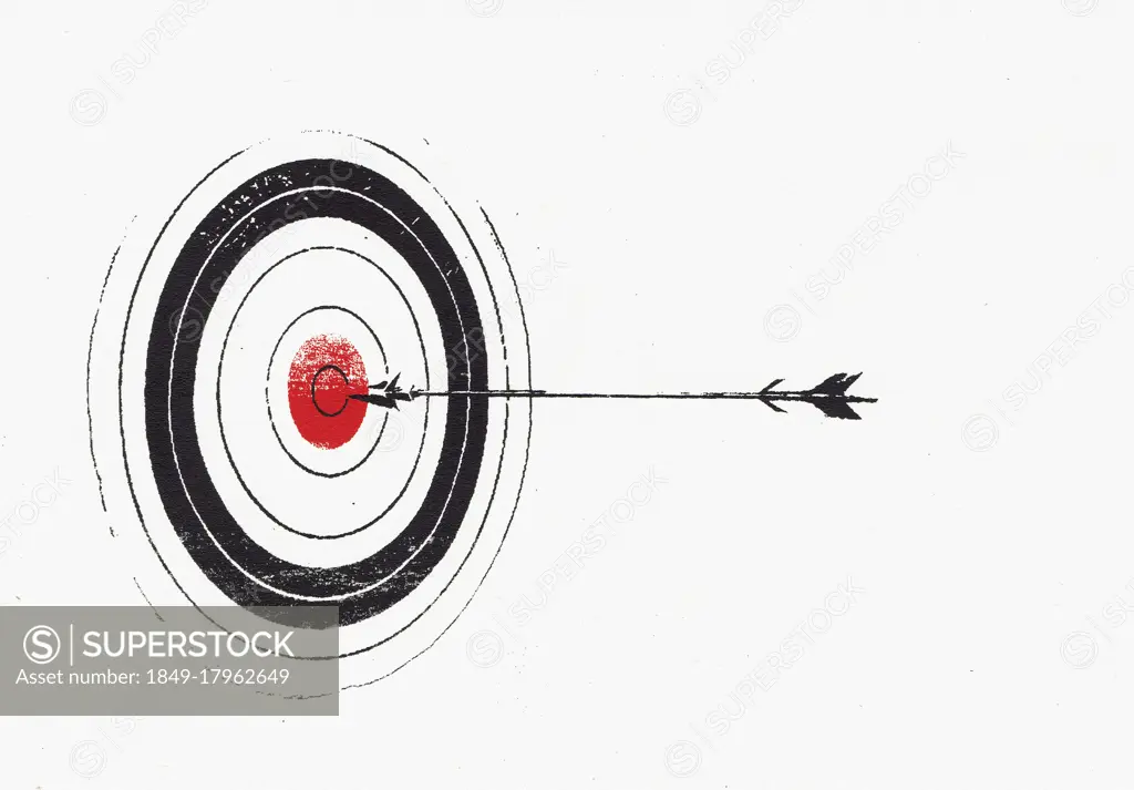 Arrow hitting bull's eye on target