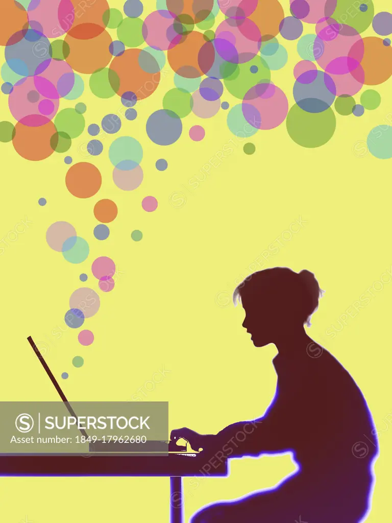 Colourful bubbles streaming from woman's computer