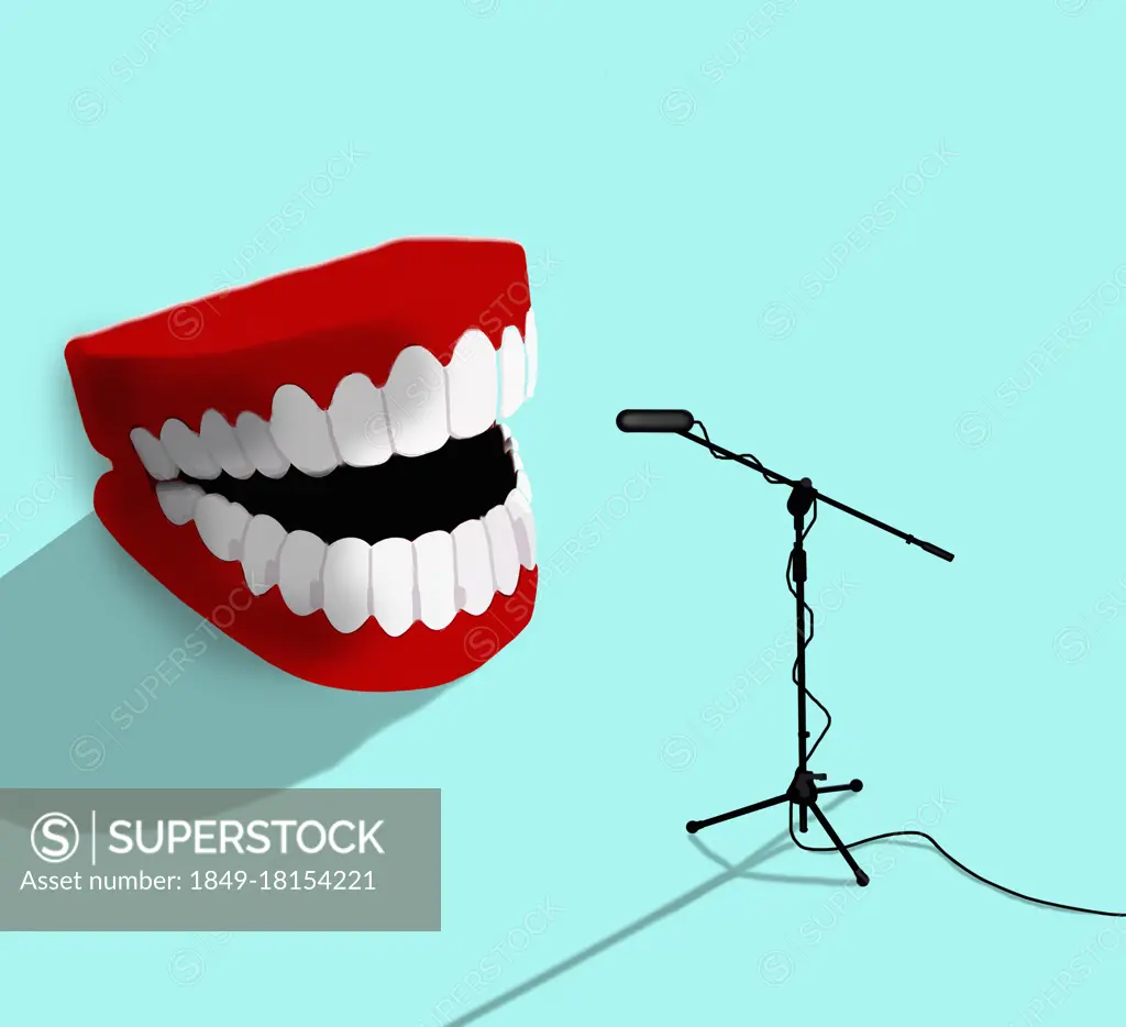 Laughing fake teeth talking into microphone