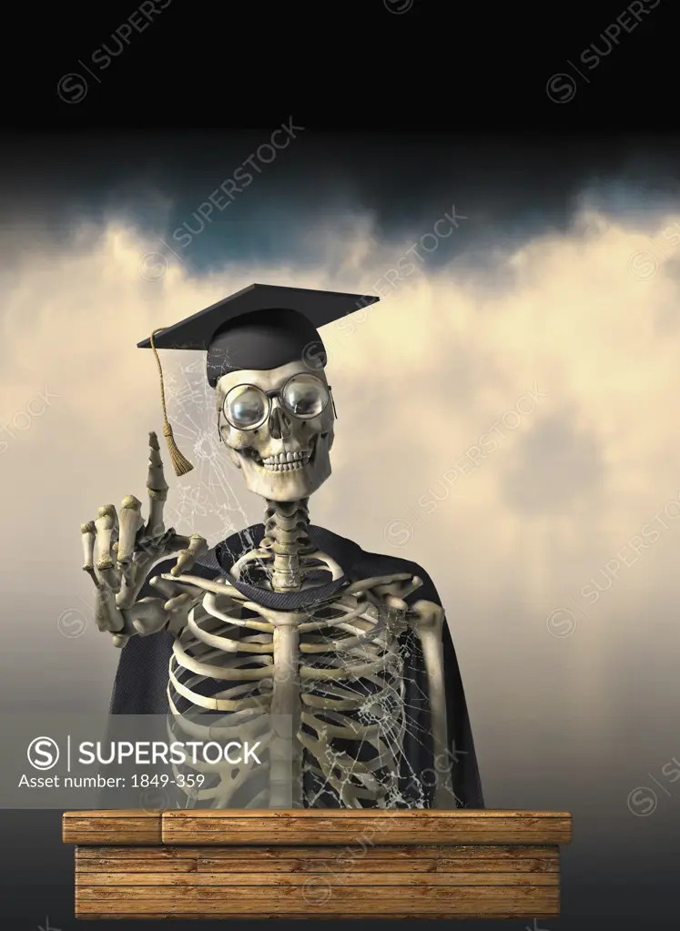 Skeleton in graduation cap and gown