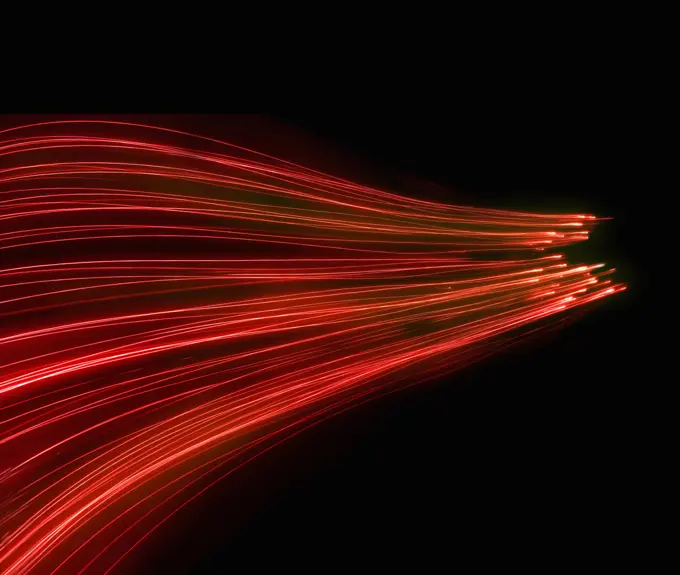 Abstract background pattern of glowing red fiber optic lights