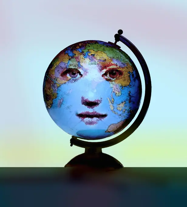 Face of woman on world globe