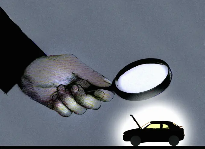 Hand holding magnifying glass over car with open bonnet