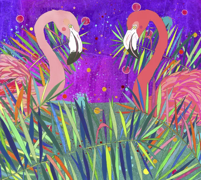 Two flamingos looking at each other in brightly coloured leaves