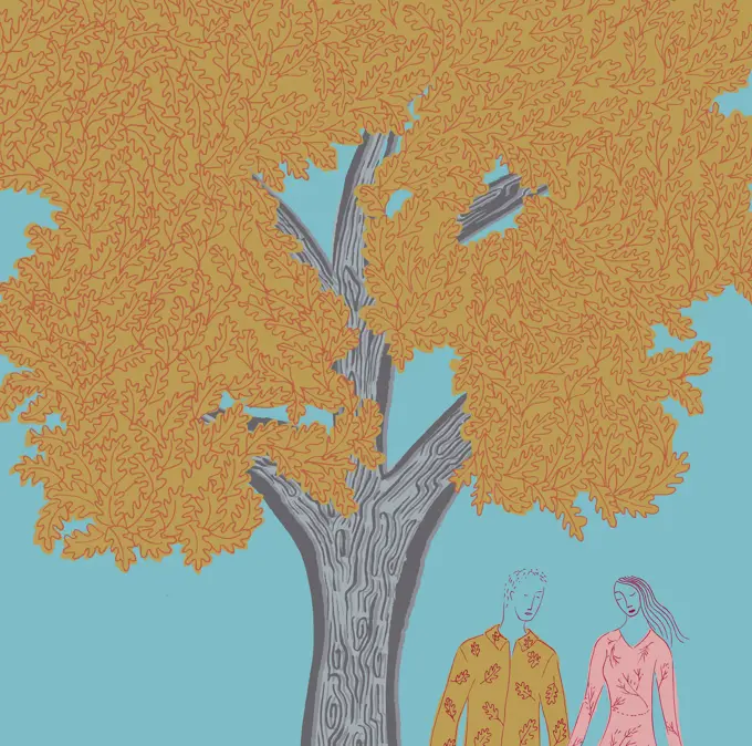 Young couple holding hands under tree