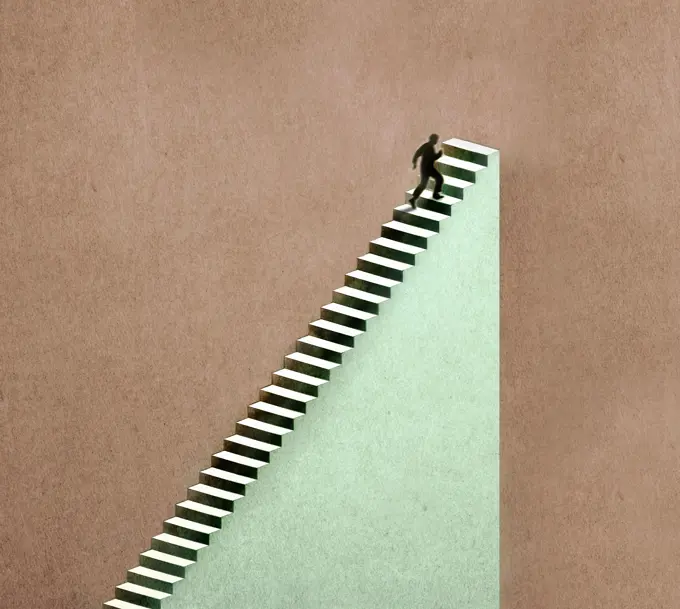 Man reaching the end of the staircase