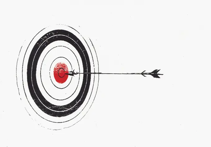 Arrow hitting bull's eye on target