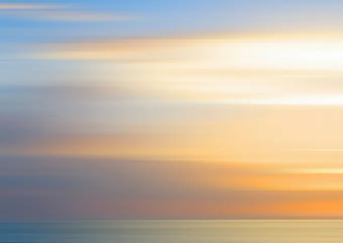 Defocused view of sunset over ocean