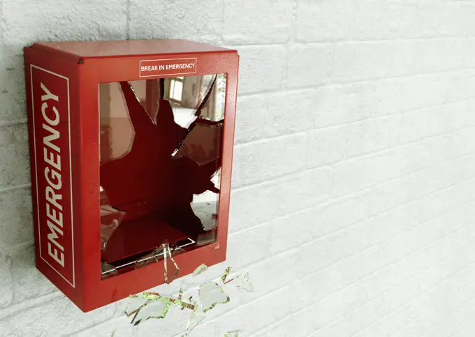 Empty red emergency box with broken glass