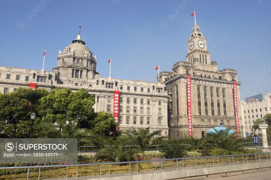 China, Shanghai, The Bund Aka Zhong Shan Road. View Of The 1930S Style Waterfront Architecture With Clock Tower And Domed Building