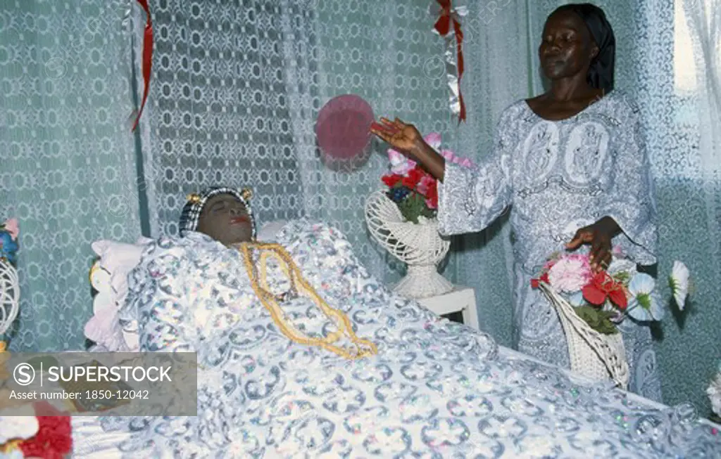 Ghana, Religion, Funeral, Deceased Woman Lying In State At Funeral With Female Attendant.  This Is Common Of Ghanaian Funerals As A Large Wake But Not Usual For Muslims.