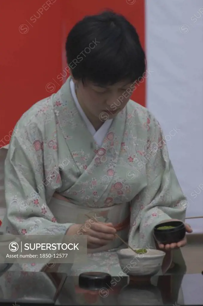 Japan, Chiba, Yokaichiba, 'Licensed Tea Master, Chiharu Koshikawa, Prepares Green Tea, ''Macha'' At A Tea Ceremony And  Places ''Macha'' Green Tea Powder In Bowl'