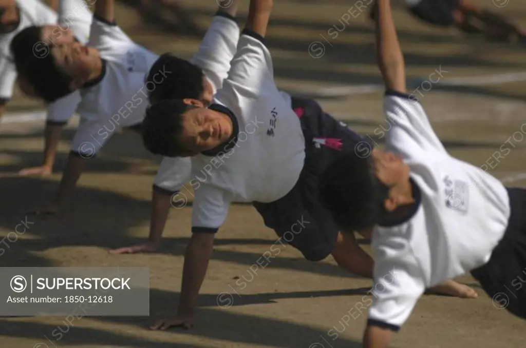 Japan, Chiba, Tako, Tako Elemetary School Undoukai Or Sports Day. 6Th Grade Boys Perform Massed Exercises 27 September 2003